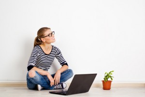 Young smiling woman dreaming of new home decor and furniture